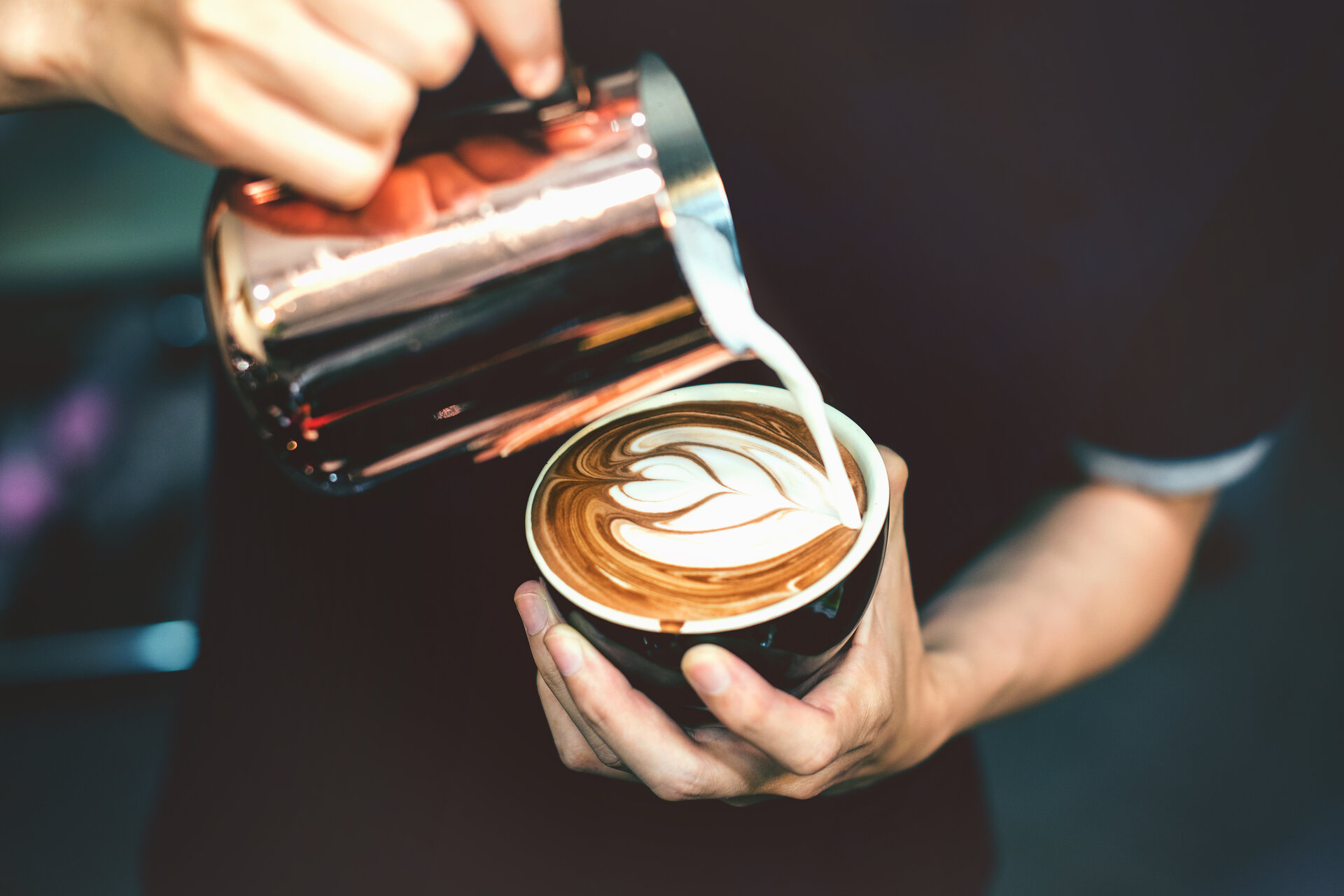 Barista making a latte