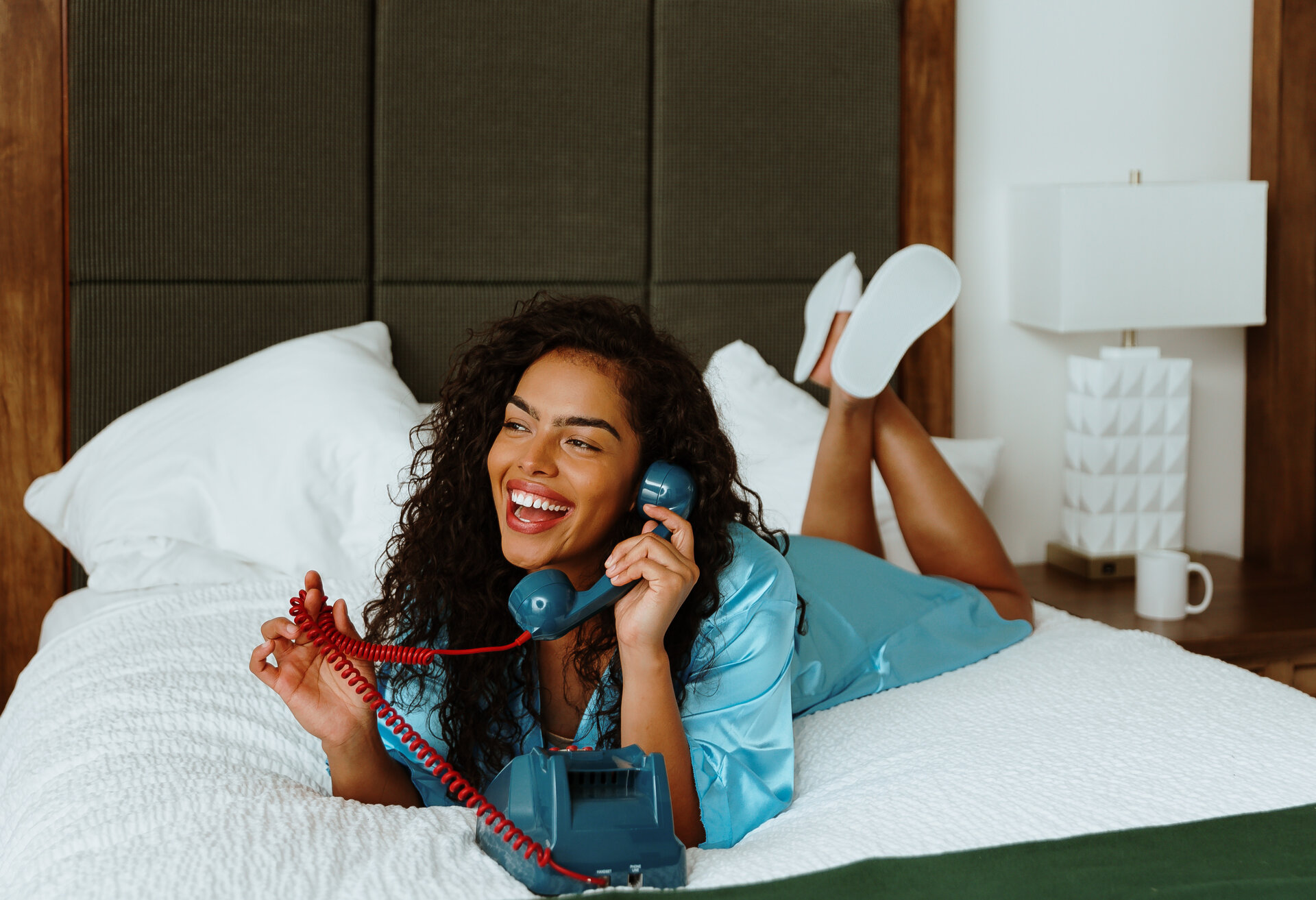 woman on phone in bed